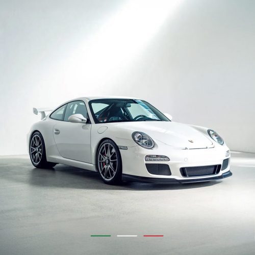 white car fitted with front splitter and a rear diffuser